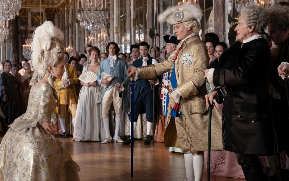 Johnny Depp as Louis XV and Maïwenn as Jeanne du Barry