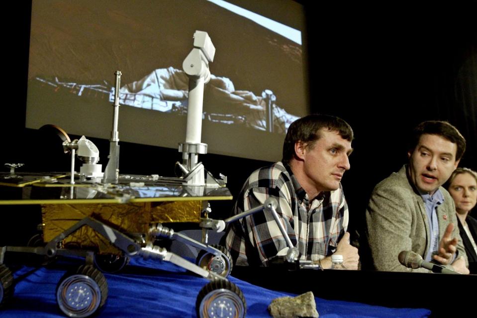 In this 2004 photo, members of the Mars Exploration Rovers team, Steve Squyres (left), Jim Bell and Jennifer Trosper, attend a news briefing at NASA. All three are part of a new documentary looking back at the improbably successful 15-year rover mission called "Good Night Oppy."