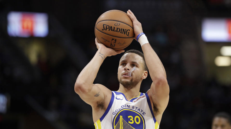 Golden State Warriors’ Stephen Curry shoots in the second half of an NBA basketball game against the Cleveland Cavaliers, Wednesday, Dec. 5, 2018, in Cleveland. (AP Photo/Tony Dejak)