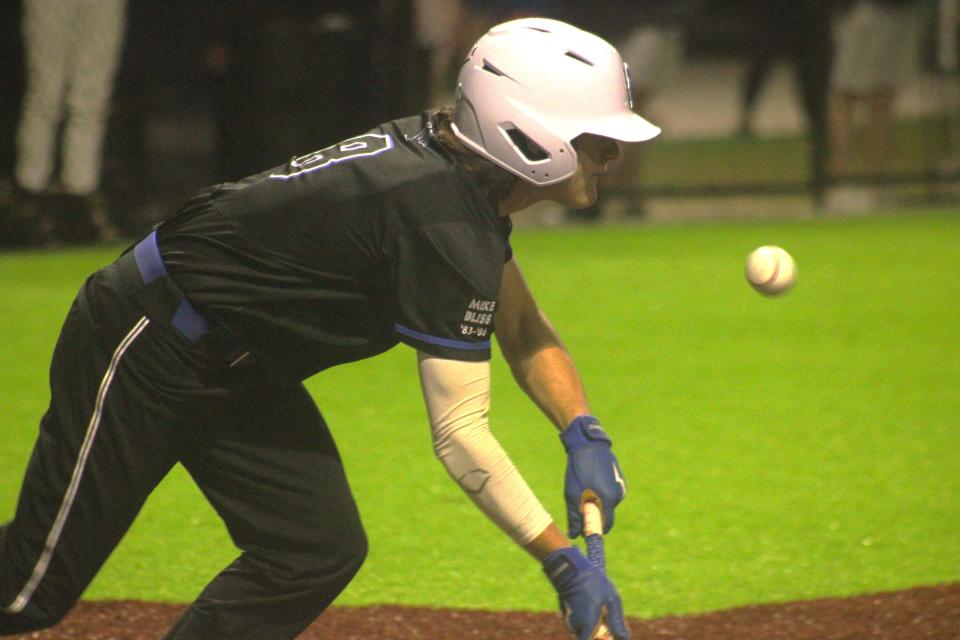 Trinity Christian batter Chandler Dantzler releases his bat after dropping down a successful bunt against Providence. The Conquerors, winners of their last 14, are ranked No. 1 in the FHSAA's new rankings.