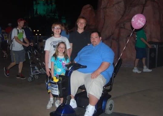 On a 2013 trip to Walt Disney World, when he weighed 477 pounds, Scott Santarlas had to rent a mobility scooter to keep up with his wife and children. (Scott Santarlas)