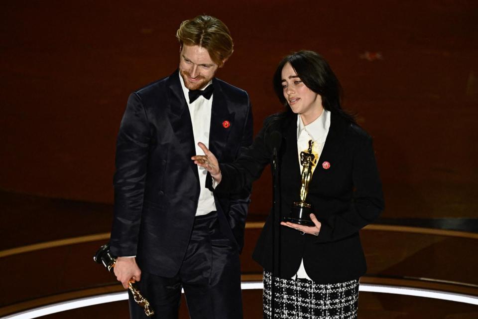 PHOTO: Billie Eilish (R) and US singer-songwriter Finneas O'Connell accept the award for Best Original Song for 'What Was I Made For' from 'Barbie' onstage during the 96th Annual Academy Awards at the Dolby Theatre in Hollywood, Calif. on March 10, 2024. (Patrick T. Fallon/AFP via Getty Images)