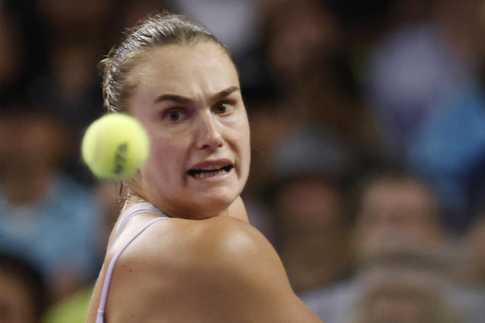 Aryna Sabalenka, of Belarus, hits against Caroline Garcia, of France, in the singles final of the WTA Finals tennis tournament in Fort Worth, Texas, Monday, Nov. 7, 2022. (AP Photo/Ron Jenkins)