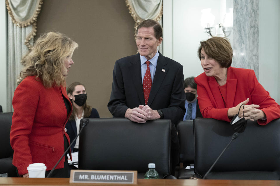 Chairman Sen. Richard Blumenthal, D-Conn., ranking member Sen. Marsha Blackburn, R-Tenn., left, and Sen. Amy Klobuchar, D-Minn., talk before Adam Mosseri, the head of Instagram, testifies before the Senate Commerce, Science, and Transportation Subcommittee on Consumer Protection, Product Safety, and Data Security hearing on Capitol Hill in Washington Wednesday Dec. 8, 2021. (AP Photo/Jose Luis Magana)