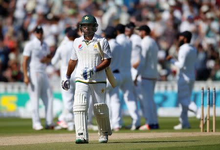 Britain Cricket - England v Pakistan - Third Test - Edgbaston - 7/8/16 Pakistan's Sami Aslam walks off after being bowled by England's Steven Finn Action Images via Reuters / Paul Childs