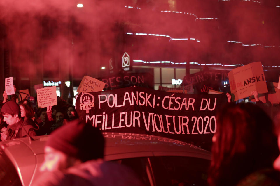 FILE - Women protest with a banner reading "Polanski: Cesar for the Best Raper 2020" near the venue of the Cesar awards ceremony, the French equivalent of the Oscar, Friday, Feb. 28, 2020 in Paris. As French cinema basks in Oscar attention, actresses who allege they were teenage victims of sexual abuse by directors decades older than them are shining the light on the repulsive underside of French cinema. Another step in the #MeToo movement that's been gathering pace in the industry could come at the French cinema awards on Friday Feb.23, 2024. (AP Photo/Rafael Yaghobzadeh)