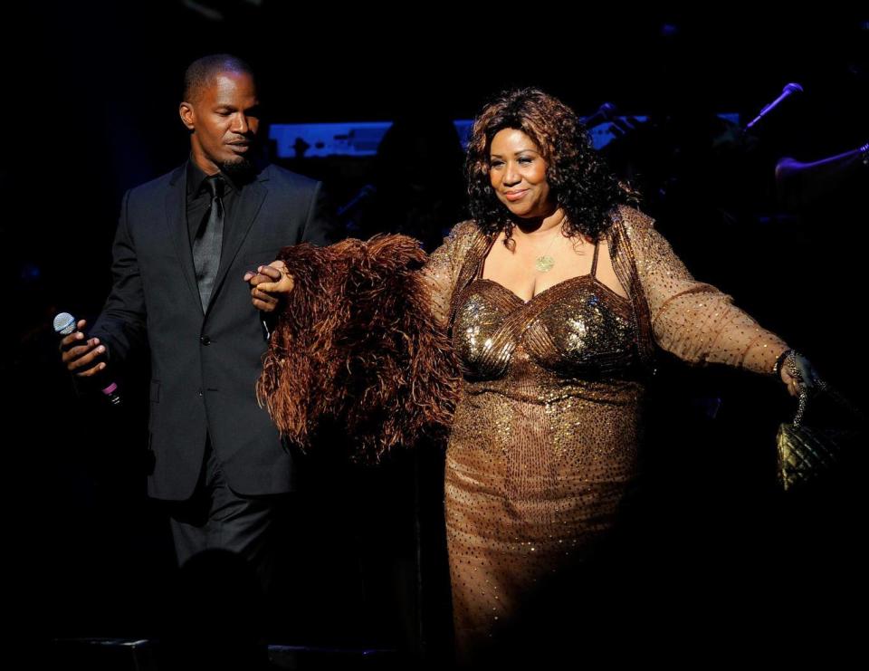 With comedian Jamie Foxx at the Apollo theatre in New York in 2010 (Getty)