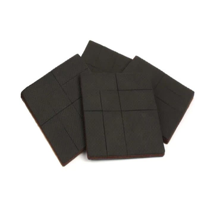 four pack of black rubber square non-slip furniture leg tips