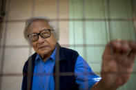 In this Oct. 24, 2013 photo, Win Tin, a former political prisoner and an opposition party stalwart poses for a picture at his home in Yangon, Myanmar. Win Tin, a prominent journalist who became Myanmar's longest-serving political prisoner after challenging military rule by co-founding the National League for Democracy has died. He was 85. He died of renal failure Monday morning, April 21, 2014, family said. (AP Photo/Gemunu Amarasinghe)