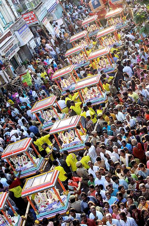 Arubathu Moovar Festival at Kapaleeswarar Temple, Chennai. <br>Situated in the heart of city of Chennai, Kapaleeswarar Temple is one of the 276 Paadal Petra Sthalams (temples that are revered in the verses of Saiva Nayanars of the 6th-9th century and considered the greatest Shiva temples of the continent) of Thirumurai. This glorious temple is closely associated with the child-saint Sambandar, one of the 63 Nayanars, who is believed to have performed a miracle by bringing back to life Angam Poompavai, daughter of a merchant Sivanesa Chettiar, who had died of snakebite. The presiding deities are Kapaleeswarar and Karpagambal.<br><br>Arupathu Moovar festival, a part of Panguni Uthiram, is celebrated to honour the Saivite devotees, namely the sixty-three Nayanars. The procession takes the Nayanars in a palanquin decorated with ornaments and flowers. Appar, Sundarar, Thirugnana Sambandar are carried in a separate palanquin. Idols of Kapaleeshwarar and Karpagambal and other deities are decorated with fragrant flowers and are taken in procession.