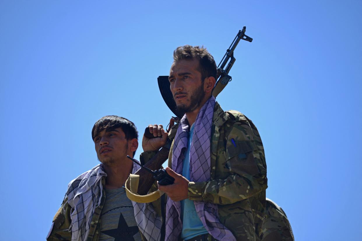 Afghan resistance movement and anti-Taliban uprising forces are pictured on a Soviet-era tank as they are deployed to patrol along a road in the Astana area of Bazarak in Panjshir province on August 27, 2021, as among the pockets of resistance against the Taliban following their takeover of Afghanistan, the biggest is in the Panjshir Valley. (Photo by Ahmad SAHEL ARMAN / AFP) (Photo by AHMAD SAHEL ARMAN/AFP via Getty Images)