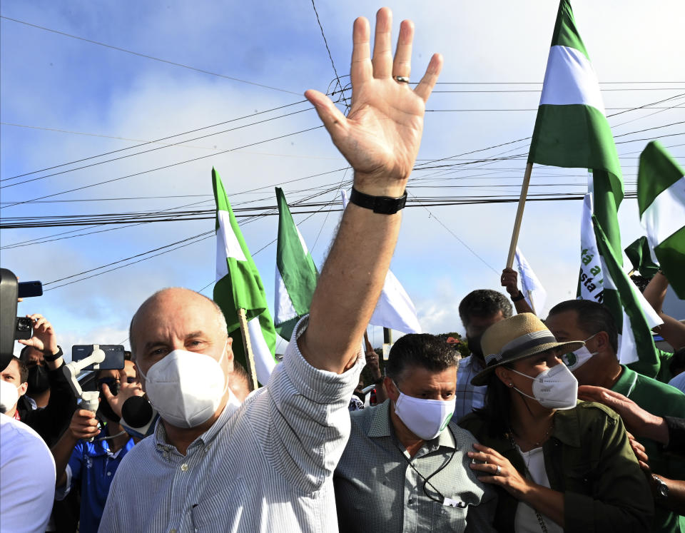 National Liberation Party presidential candidate Jose Maria Figueres greets supporters upon his arrival at a polling station during a runoff presidential election, in San Jose, Costa Rica, Sunday, April 3, 2022. Figueres a former president and Rodrigo Chavez a treasury minister from Costa Rica's outgoing administration, face off to become the country's next leader. (AP Photo/Carlos Gonzalez)