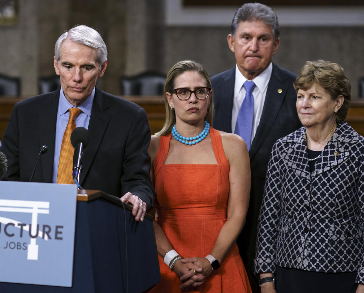 Bipartisan Senate negotiators, from left, Sen. Rob Portman, R-Ohio, Sen. Kyrsten Sinema, D-Ariz., Sen. Joe Manchin, D-W.Va., and Sen. Jeanne Shaheen, D-N.H. (J. Scott Applewhite/AP)