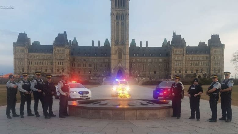 Thousands of Mounties sign union cards and remove the yellow stripes from their pants