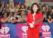 <p>Grimes paired a cute red blouse with a matching embellished skirt. </p>