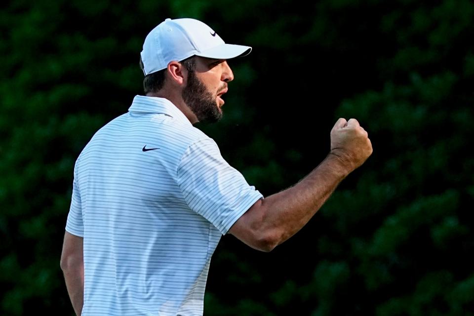 Scottie Scheffler gives a fist pump after his eagle at the par-5 13th hole of the Augusta National Golf Club to take the lead in the third round of the Masters Tournament on April 13.