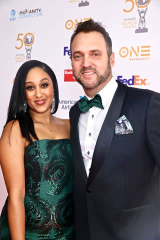 <p>Robin L Marshall/Getty</p> Tamera Mowry and husband Adam Housley attend the 50th NAACP Image Awards Dinner at The Beverly Hilton on March 29, 2019