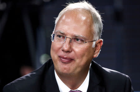 FILE PHOTO: The chief executive of the Russian Direct Investment Fund, Kirill Dmitriev, waits before a meeting of Russian President Vladimir Putin with representatives of the foreign business community on the sidelines of the Eastern Economic Forum in Vladivostok, Russia September 11, 2018. Valery Sharifulin/TASS Host Photo Agency/Pool via REUTERS/File Photo