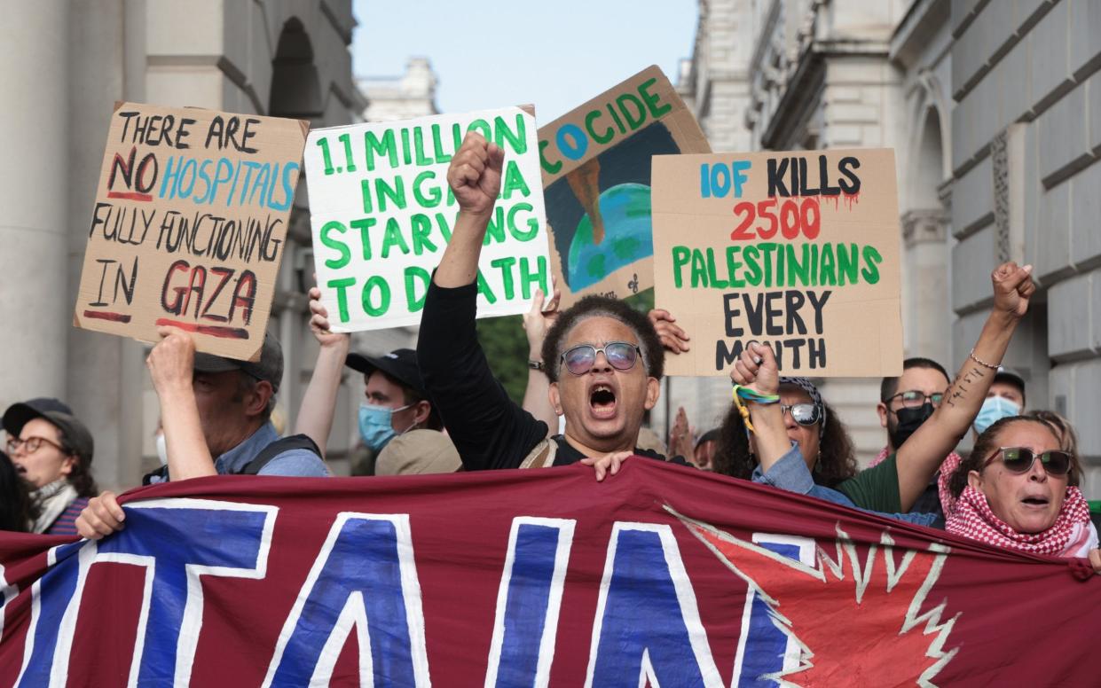 Pro-Palestine protesters are pictured this morning outside the Foreign Office