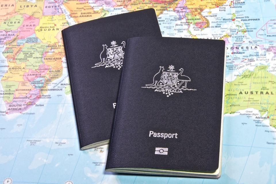 Australian passports on world map.