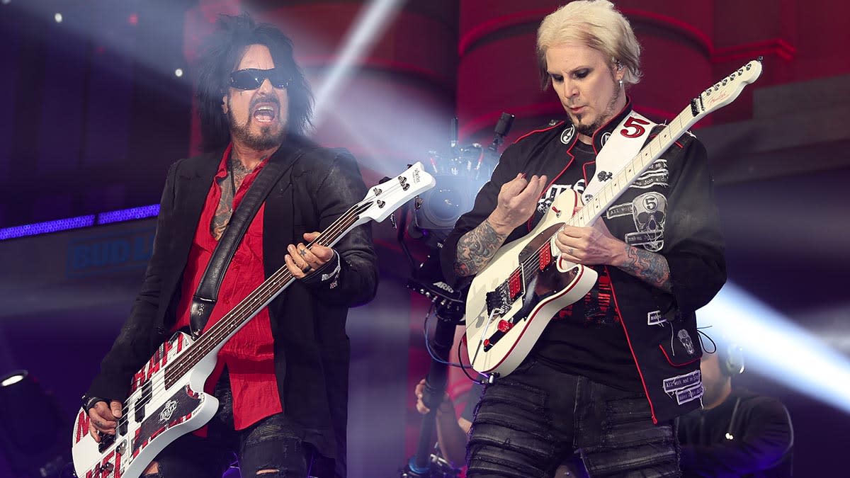  Mötley Crüe's Nikki Sixx (left) and John 5 onstage in Kansas 