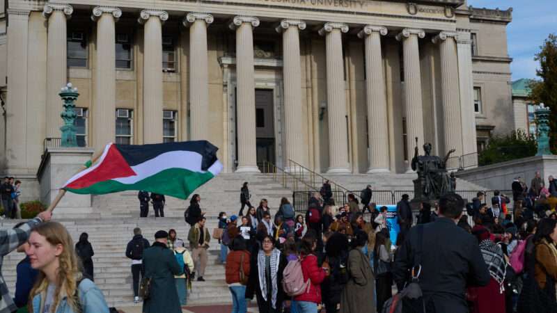 Columbia University faculty members stand on the steps of The Low Library to protest the ban of Jewish Voice for Peace and Students for Justice in Palestine on the college campus.