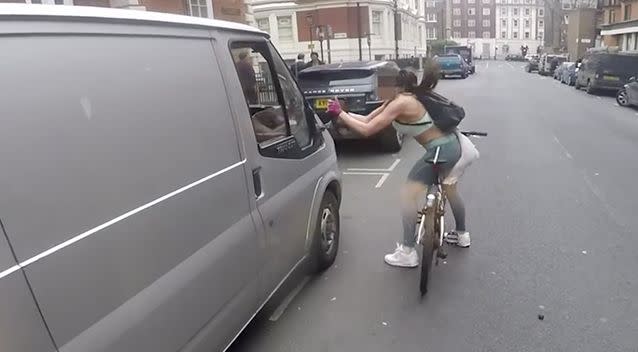 The camera also arrives, just in time, two blocks away to see the angry cyclist extra vegeance from the van's wing mirror. Photo: Screenshot