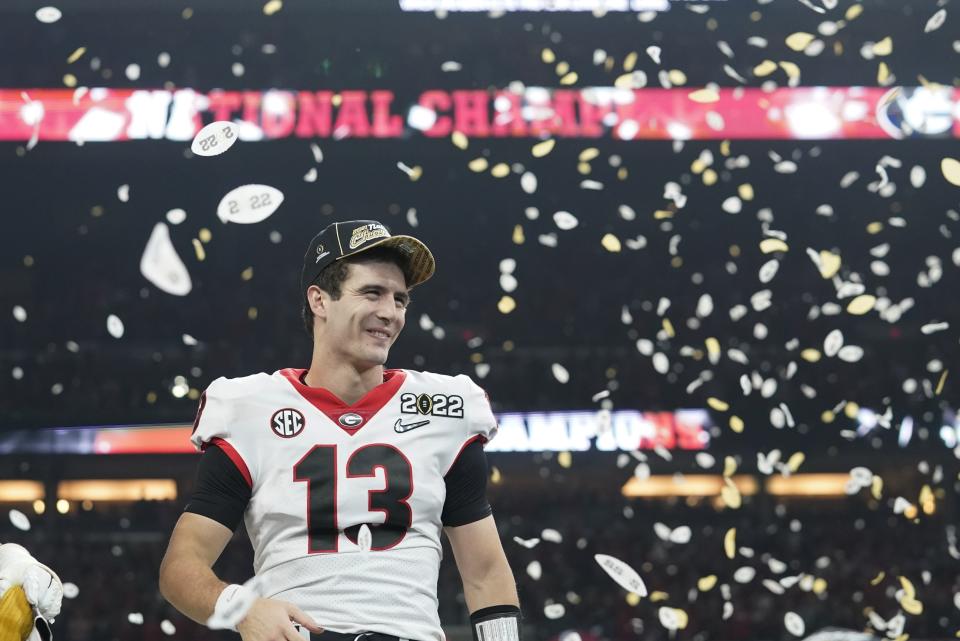 Georgia's Stetson Bennett celebrates after the College Football Playoff championship football game against Alabama Tuesday, Jan. 11, 2022, in Indianapolis. Georgia won 33-18. (AP Photo/Darron Cummings)