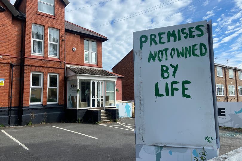 The sign has been painted over outside Life Wirral.