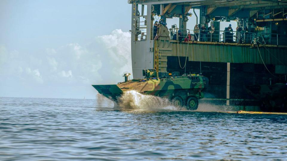 A U.S. Marine Corps amphibious combat vehicle splashes off the amphibious dock landing ship Harpers Ferry during the exercise Balikatan in Palawan, Philippines, on May 4, 2024. (Lance Cpl. Peyton Kahle/U.S. Marine Corps)