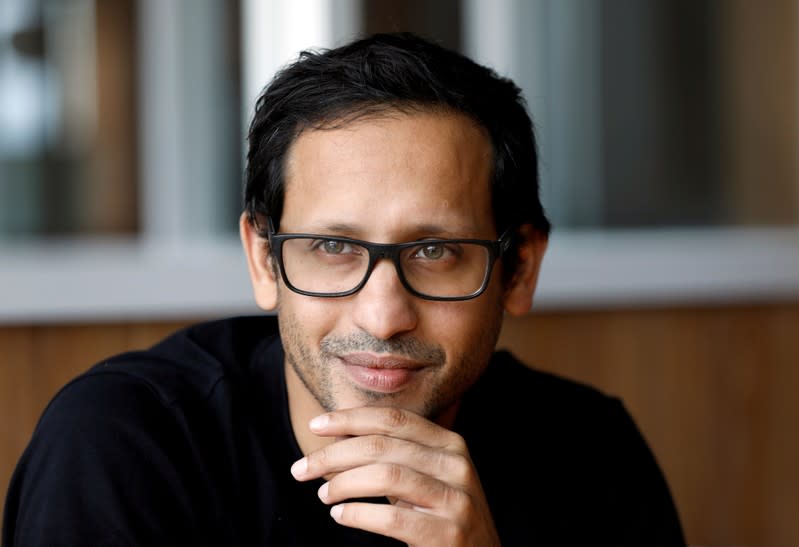 FILE PHOTO: Nadiem Makarim, founder of the Indonesian ride-hailing and online payment firm Go-Jek, listens during an interview with Reuters at the Go-Jek offices in Jakarta