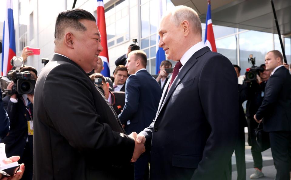North Korean leader Kim Jong-Un (left) shaking hands with Russian President Vladimir Putin (right).