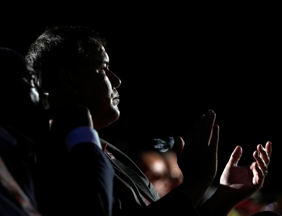 Columbus city official and activists gathered Friday night to call for what they called common sense gun control and to honor community members lost to gun violence. Mayor Andrew J. Ginther, pictured, applauds a speaker at the gun violence awareness vigil at City Hall.