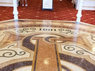 floor mosaic inside the town square theater in dinsey world