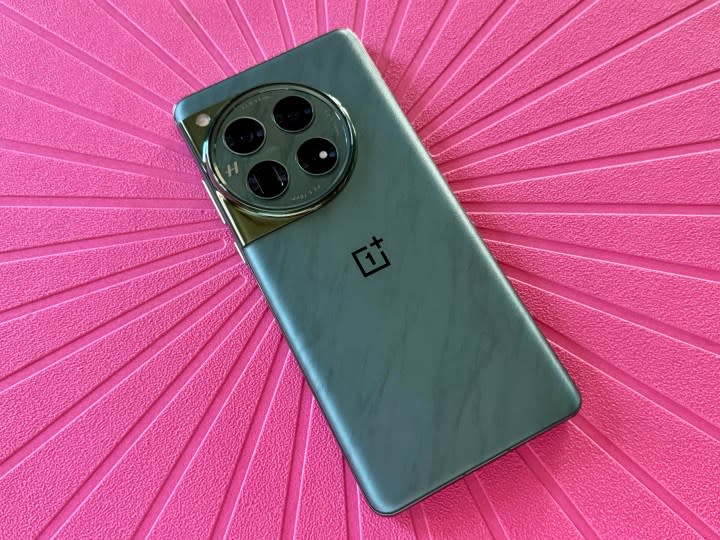 OnePlus 12 in Flowy Emerald laying flat.