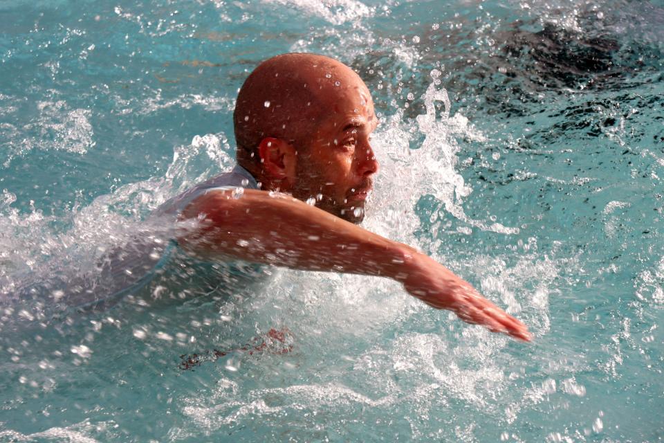 Shane Petrey with team Get Fit swims through the cold water as he participates in the annual Special Olympics Polar Plunge held at Amarillo Town Club on Hillside Saturday morning.