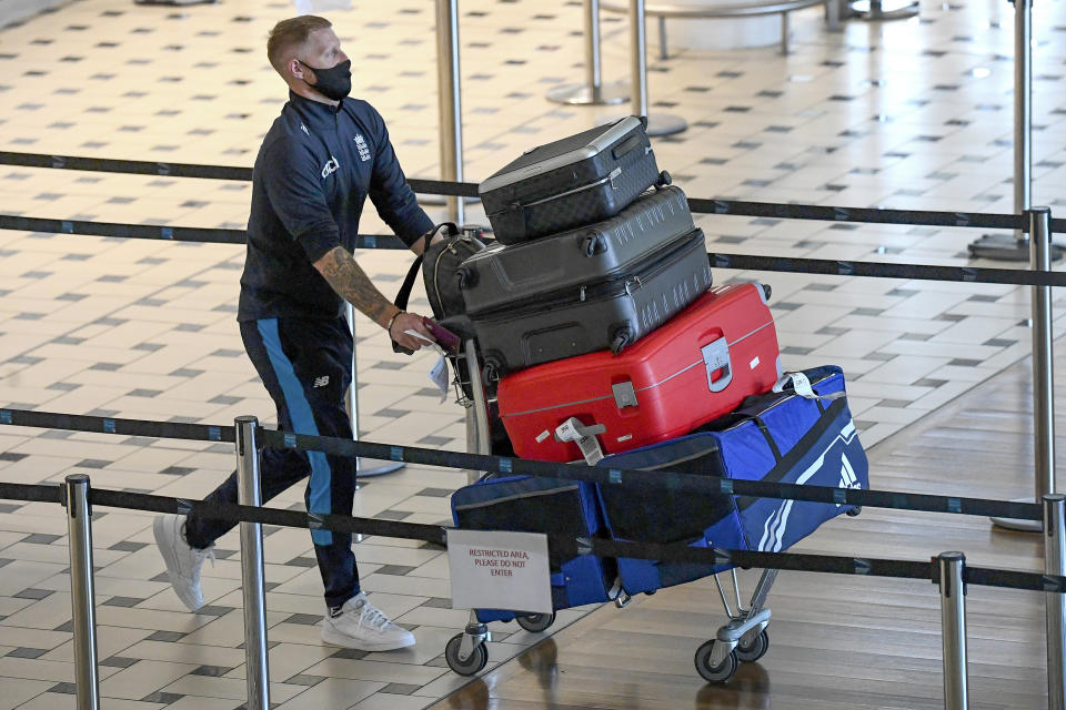 England cricketer Ben Stokes walks through the terminal at Brisbane Airport in Australia, Saturday, Nov. 6, 2021. The England cricket team have arrived in Australia ahead of a five test Ashes series beginning on Dec. 8 in Brisbane. (Dave Hunt/AAP Image via AP)