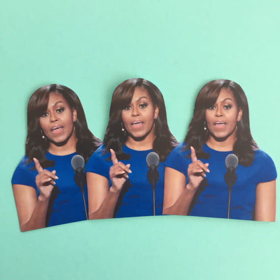 Buy the <a href="https://www.etsy.com/listing/455807518/michelle-obama-inspired-sticker-set?ga_order=most_relevant&amp;ga_search_type=all&amp;ga_view_type=gallery&amp;ga_search_query=michelle%20obama&amp;ref=sr_gallery_28" target="_blank">Sassy Celebs "Michelle Obama-Inspired" stickers </a>for $2.75