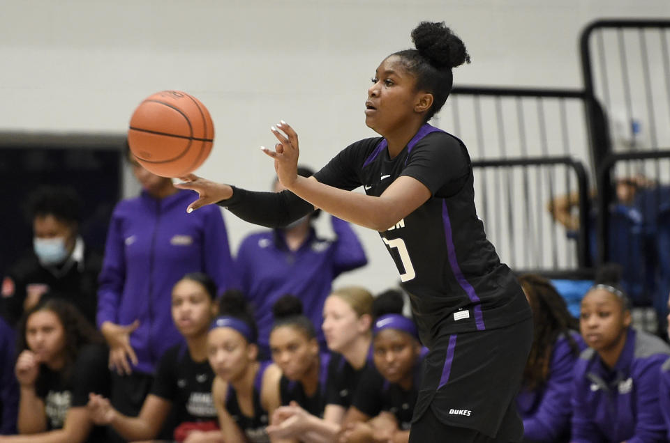 Kiki Jefferson of the James Madison Dukes passes the ball against the George Washington Colonials at Charles E. Smith Athletic Center on December 02, 2021 in Washington, DC.