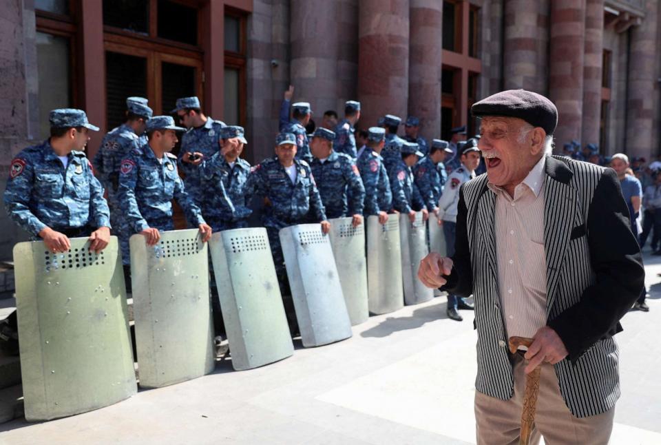 PHOTO: A protester reacts next to law enforcement officers during a gathering outside the government building following the launch of a military operation by Azerbaijani forces in the region of Nagorno-Karabakh, in Yerevan, Armenia, Sept. 20, 2023. (Irakli Gedenidze/Reuters)