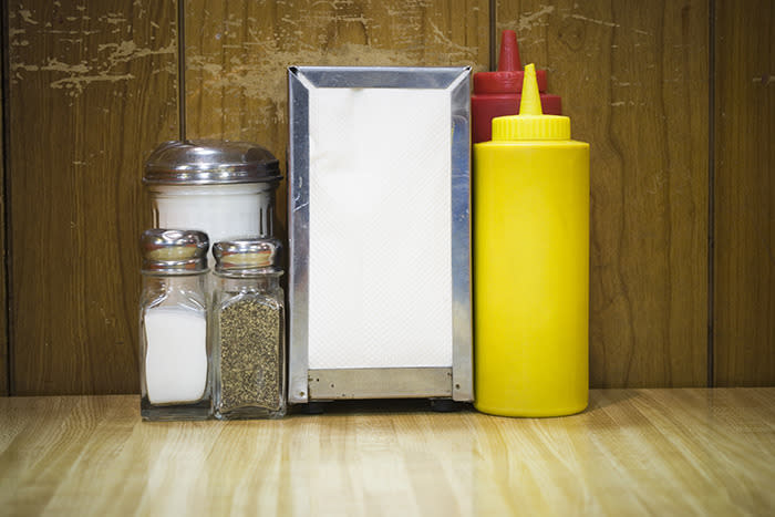 The ketchup bottle and salt and pepper shakers