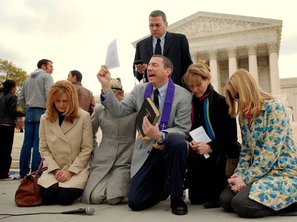 WASHINGTON - APRIL 18: The Rev. Rob Schenck (C), president of the National Clergy Council, leads pro-life advocates in prayer on the steps of the Supreme Court April 18, 2007 in Washington, DC. The Court today in a 5-4 ruling upheld a federal partial-birth abortion ban. (Photo by Jonathan Ernst/Getty Images)