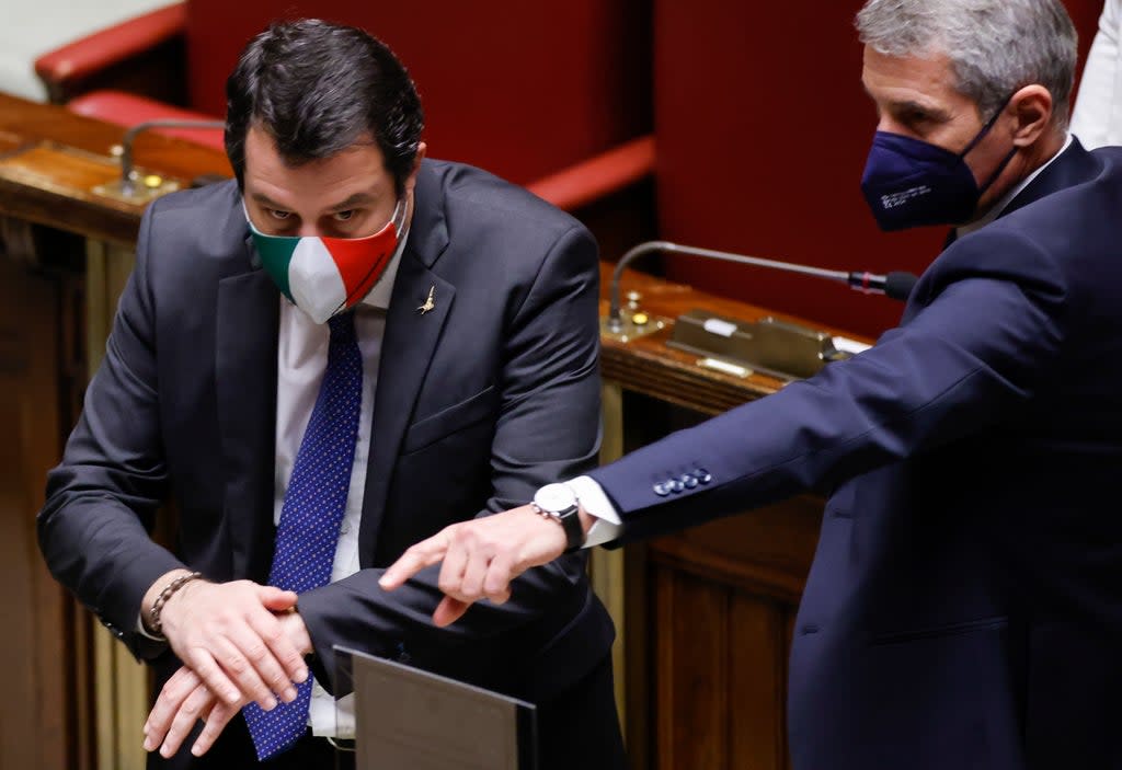 Member of Parliament Matteo Salvini, left, prepares to cast his ballot in the Italian parliament (AP)