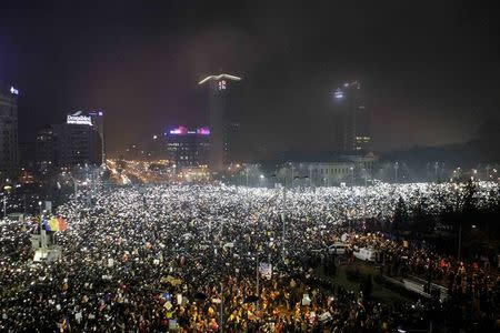 Protesters use phones and flashlights during a protest in Victoriei Square, in Bucharest, Romania, February 5, 2017. Inquam Photos/Adriana Neagoe/via REUTERS