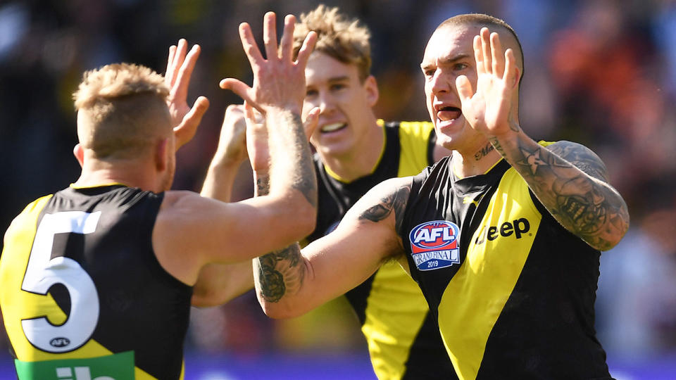 Dustin Martin, pictured here celebrating with teammates after kicking a goal.