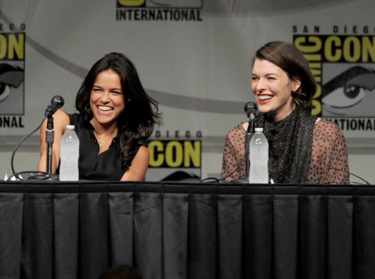 Michelle Rodriguez and Milla Jovovich speak at Comic-Con in 2012. (Photo: Getty)