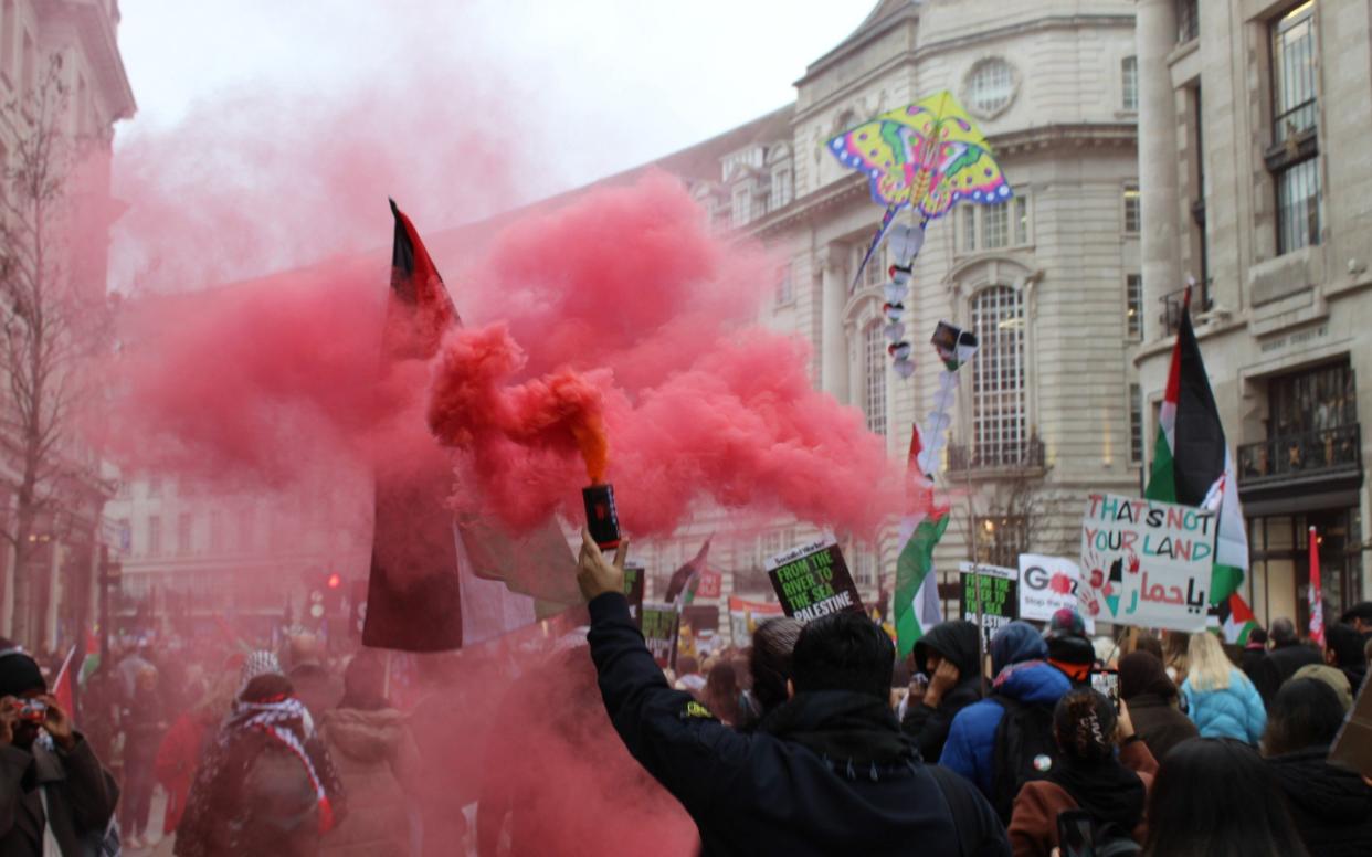 Thousands of people, holding banners and Palestinian flags, gather in front of the BBC in Portland Place and later held a march