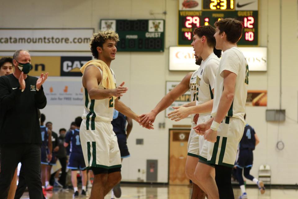 Justin Mazzulla, left, seen in action last season, will play in front of family and friends this week in Rhode Island when Vermont takes on Providence and Brown.