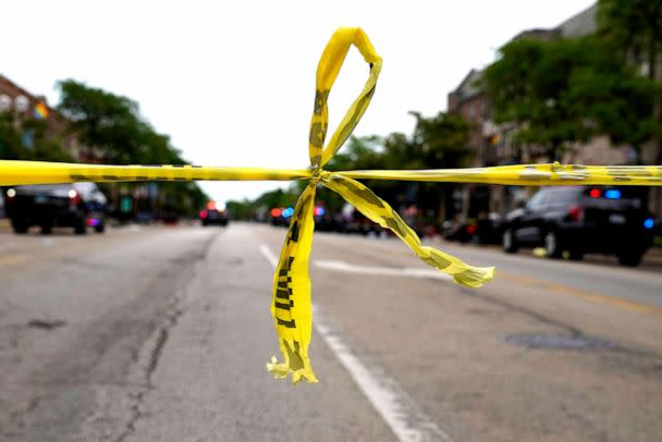 PHOTO: Police tape hangs at corner of Central Avenue and Green Bay Rd., in Highland Park, a Chicago suburb, Monday, July 4, 2022, after a mass shooting at Highland Park Fourth of July parade.  (Nam Y. Huh/AP)
