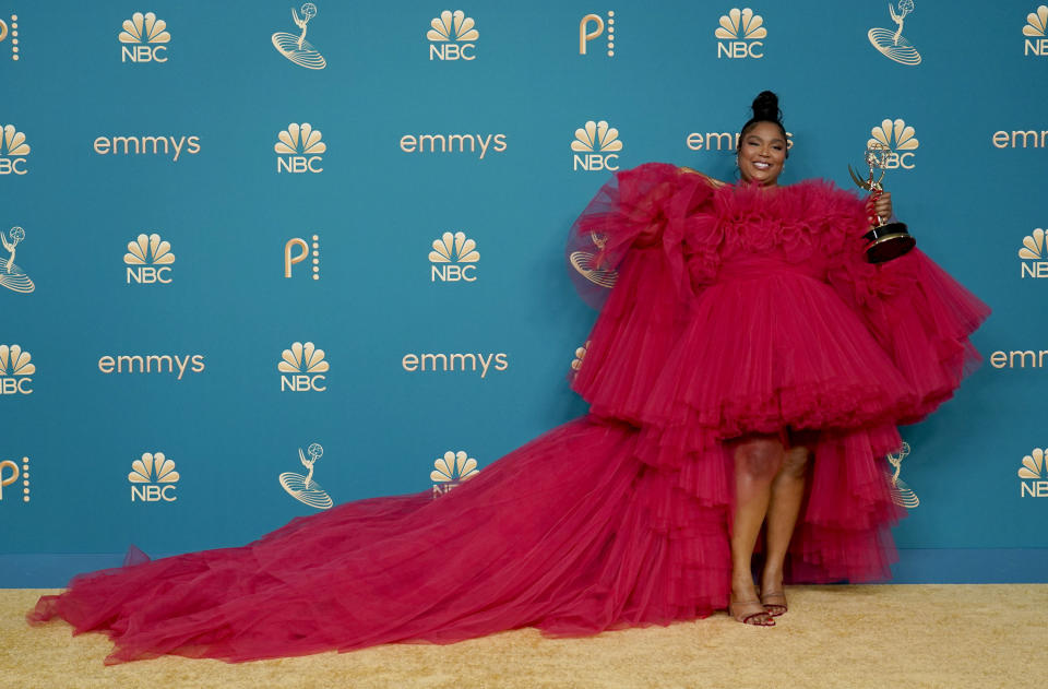 Lizzo poses in the press room with the award for outstanding competition program for "Lizzo's Watch Out For The Big Grrrls" at the 74th Primetime Emmy Awards on Monday, Sept. 12, 2022, at the Microsoft Theater in Los Angeles. (AP Photo/Jae C. Hong)